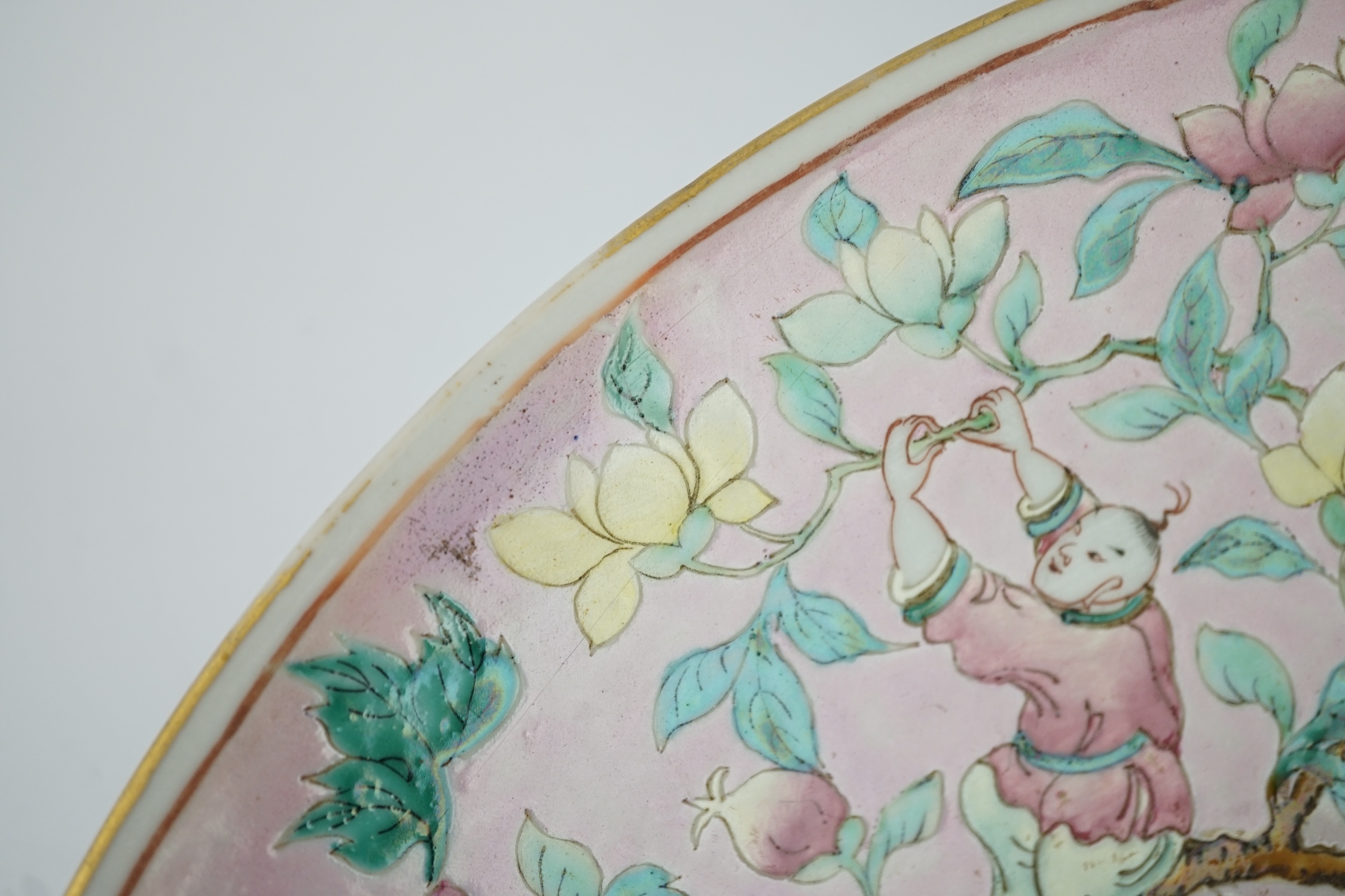 A Chinese enamelled porcelain pink ground ‘boys’ dish, mid 19th century
